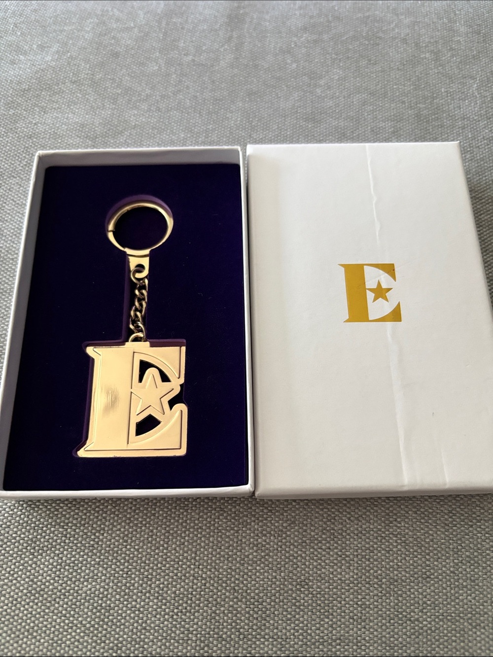 Gold Letter 'E' Keychain with Star Accent Elton John